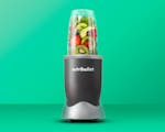 Product preview 1 of 7. Thumbnail nutribullet with fruit and vegetables on green background.